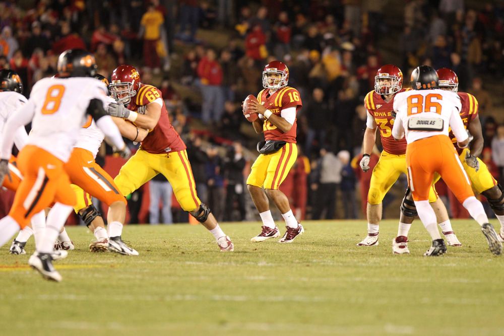 AMES, IA - NOVEMBER 18:  Jared Barnett #16 of the Iowa State Cyclones looks to pass against the Oklahoma State Cowboys at Jack Trice Stadium November 18, 2011 in Ames, Iowa.  (Photo by Reese Strickland/Getty Images)