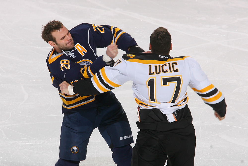 BUFFALO, NY - NOVEMBER 23: Paul Gaustad #28 of the Buffalo Sabres fights with Milan Lucic #17 of the Boston Bruins early in the first period  at First Niagara Center on November 23, 2011 in Buffalo, New York.  (Photo by Rick Stewart/Getty Images)