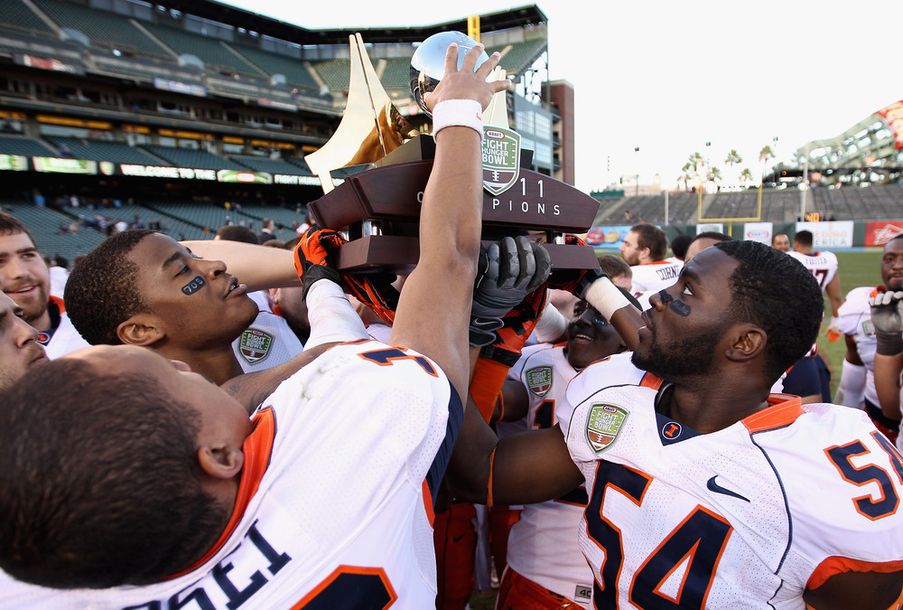 SAN FRANCISCO, CA - DECEMBER 31:  The Illinois Fighting Illini celebrate with the trophy after they beat the UCLA Bruins in the Kraft Fight Hunger Bowl at AT&T Park on December 31, 2011 in San Francisco, California.  (Photo by Ezra Shaw/Getty Images)