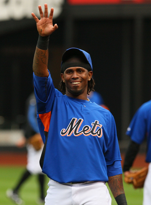 This is a picture of Jose Reyes with his hand in the air for some reason. (Photo by Mike Stobe/Getty Images)