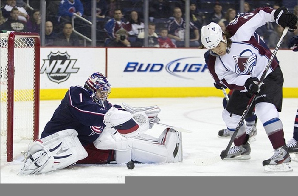 February 24, 2012; Columbus, OH, USA; Columbus Blue Jackets goalie Steve Mason (1) makes a save on Colorado Avalanche right wing Steve Downie (27) at Nationwide Arena.  Mandatory Credit: Greg Bartram-US PRESSWIRE