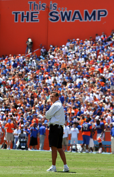 GAINESVILLE, FL - APRIL 10:  Head coach Urban Meyer of the Florida Gators coaches his team during the Orange & Blue game at Ben Hill Griffin Stadium on April 10, 2010 in Gainesville, Florida.  (Photo by Doug Benc/Getty Images)