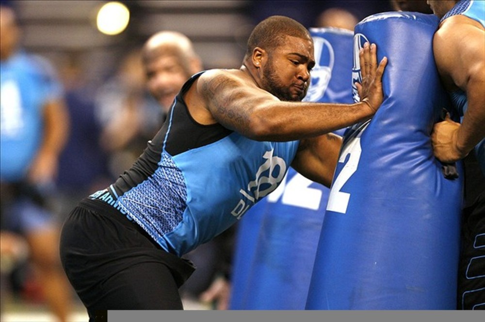 Feb 27, 2012; Indianapolis, IN, USA; California defensive lineman Trevor Guyton hits the tackling dummy during the NFL Combine at Lucas Oil Stadium. Mandatory Credit: Brian Spurlock-US PRESSWIRE