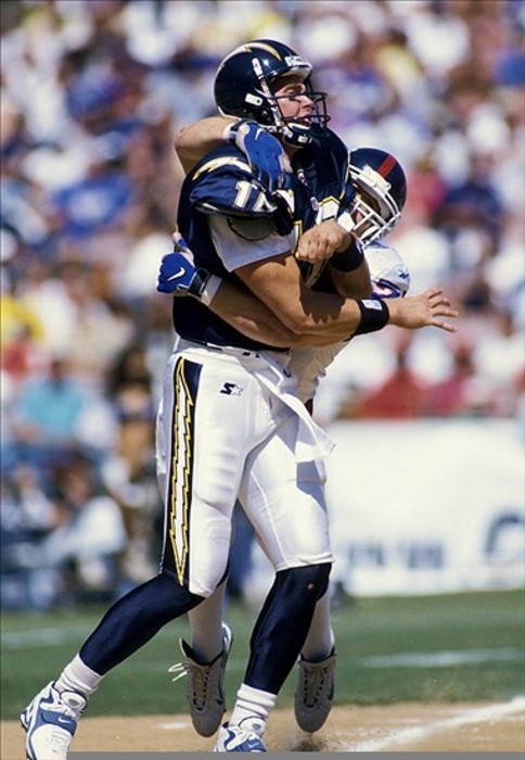 Sep 27, 1998; San Diego, CA, USA: FILE PHOTO; San Diego Chargers quarterback Ryan Leaf (16) is hit by New York Giants defensive end Chad Bratzke (77) at Qualcomm Stadium. Mandatory Credit: Peter Brouillet-US PRESSWIRE