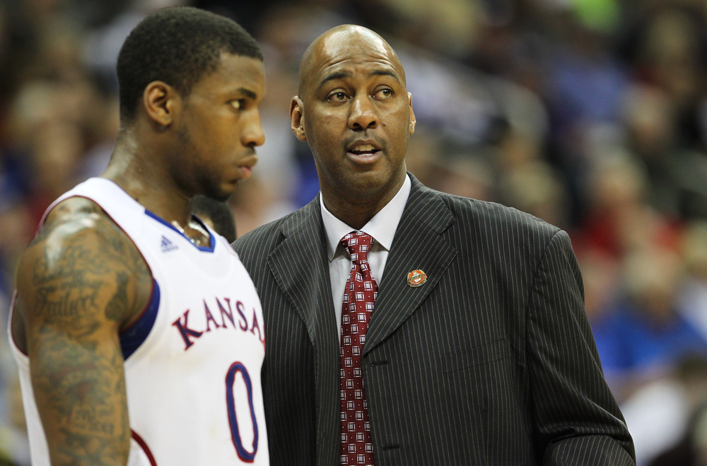 Former NBA player Danny Manning talks to Thomas Robinson #0 of the Kansas Jayhawks. Manning has accepted the head coaching job at Tulsa. 