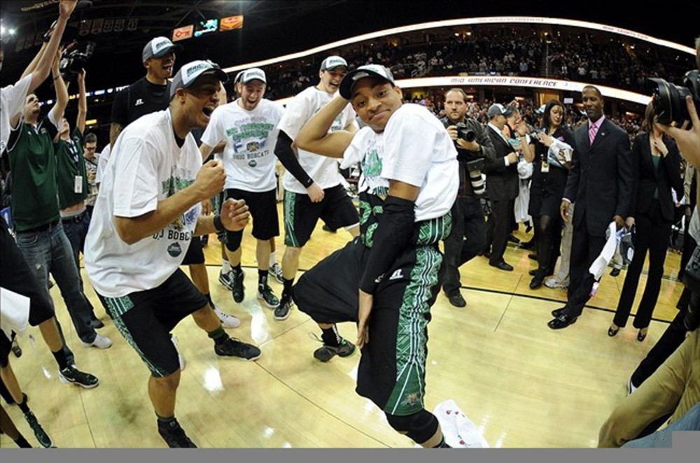 March 10, 2012; Cleveland, OH, USA: Ohio Bobcats guard Stevie Taylor (center) with his teammates after defeating the Akron Zips 64-63 in the finals of the 2012 MAC Tournament at Quicken Loans Arena.  Mandatory Credit: Eric P. Mull-USPRESSWIRE