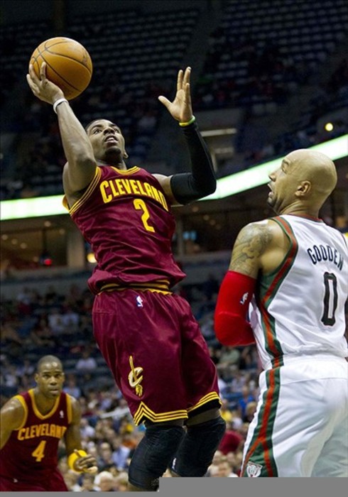 Mar 14, 2012; Milwaukee, WI, USA;  Cleveland Cavaliers guard Kyrie Irving (2) shoots over Milwaukee Bucks forward Drew Gooden (0) during the first quarter at the Bradley Center.  Mandatory Credit: Jeff Hanisch-US PRESSWIRE