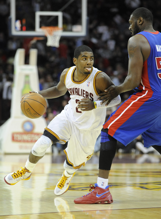 Mar 28, 2012; Cleveland, OH, USA; Cleveland Cavaliers point guard Kyrie Irving (2) drives around Detroit Pistons forwardcenter Jason Maxiell (54) in the third quarter at Quicken Loans Arena. Mandatory Credit: David Richard-US PRESSWIRE