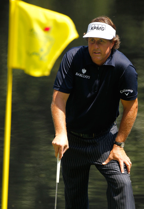 AUGUSTA, GA - APRIL 04:  Phil Mickelson lines up a putt during the Par 3 Contest prior to the start of the 2012 Masters Tournament at Augusta National Golf Club on April 4, 2012 in Augusta, Georgia.  (Photo by Streeter Lecka/Getty Images)