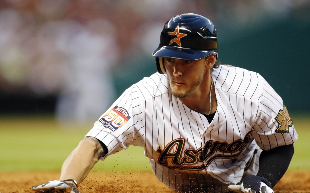 Apr 6, 2012; Houston, TX, USA; Houston Astros center fielder Jordan Schafer (1) dives back to first against the Colorado Rockies in the fifth inning at Minute Maid Park. Mandatory Credit: Brett Davis-US PRESSWIRE