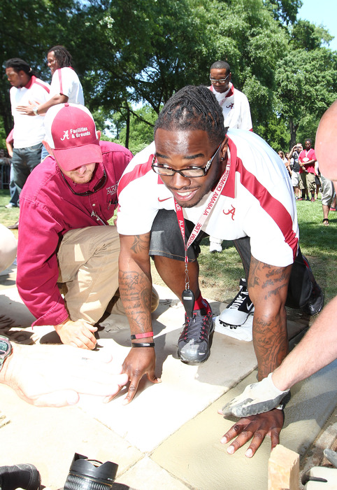 April 14, 2012; Tuscaloosa, AL, USA;  Alabama Crimson Tide former running back Trent Richardson makes his hand print in the walk of champions prior to the spring game at Bryant Denny Stadium. Mandatory Credit: Marvin Gentry-US PRESSWIRE