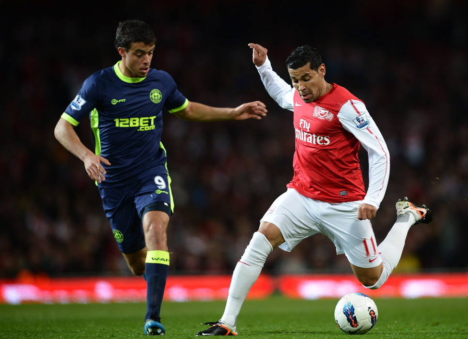 Andre Santos of Arsenal and Franco Di Santo of Wigan battle for the ball during the Barclays Premier League match between Arsenal and Wigan Athletic at Emirates Stadium.