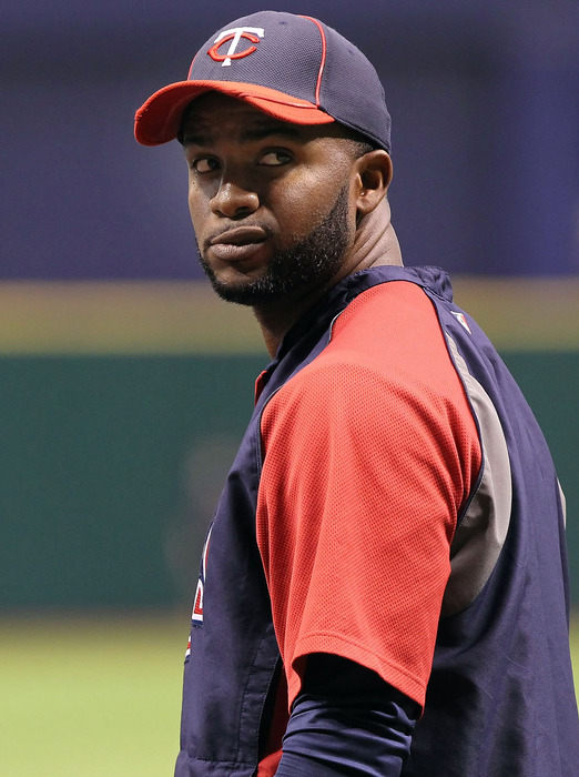 April 20, 2012; St. Petersburg, FL, USA; Minnesota Twins center fielder Denard Span (2) warms up prior to the game against the Tampa Bay Rays at Tropicana Field. Mandatory Credit: Kim Klement-US PRESSWIRE