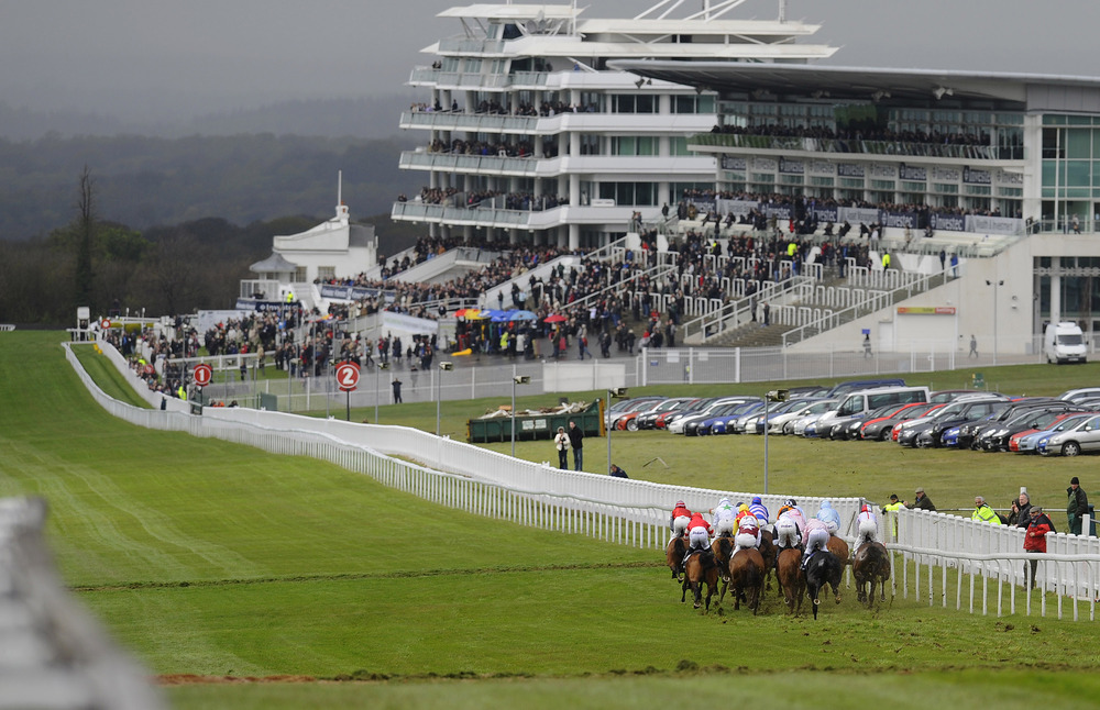 EPSOM, ENGLAND - APRIL 25: Runners sprint down the hills towards the finish in The Investec Specialist Bank Handicap Stakes at Epsom racecourse on April 25, 2012 in Epsom, England. (Photo by Alan Crowhurst/Getty Images)
