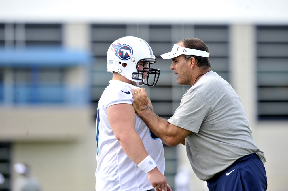 May 11, 2012; Nashville, TN, USA; Tennessee Titans offensive line coach Bruce Matthews gives instruction to center William Vlachos (67) during minicamp at the Titans training facility at Baptist Sports Park. Mandatory Credit: Jim Brown-US PRESSWIRE
