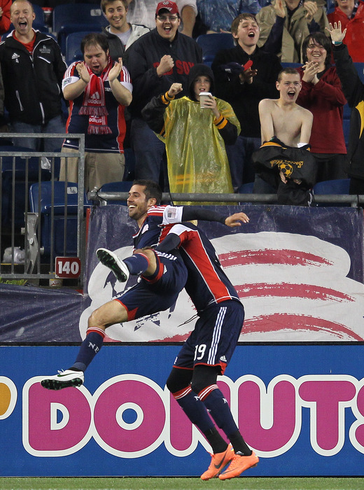 FOXBORO, MA - JUNE 2:  Benny Feilhaber #22 of the New England Revolution celebrates his goal with teammate Saer Sene #19 against the Chicago Fire at Gillette Stadium on June 2, 2012 in Foxboro, Massachusetts. (Photo by Jim Rogash/Getty Images)