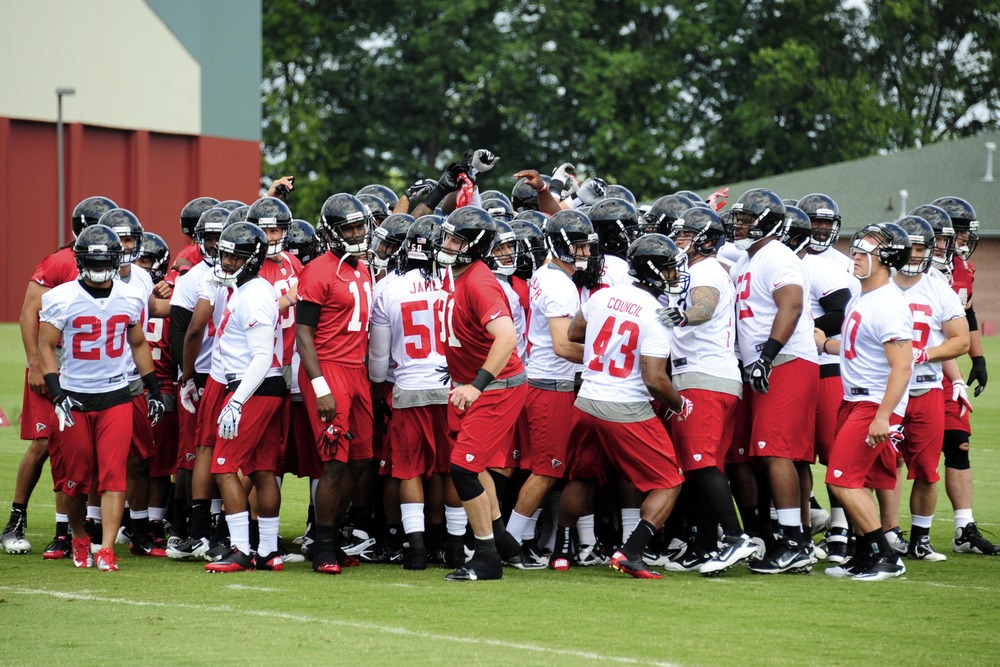 June 6, 2012; Flowery Branch, GA, USA; Atlanta Falcons players break the team huddle on the field during organized team activities at the Falcons training facility. Mandatory Credit: Dale Zanine-US PRESSWIRE