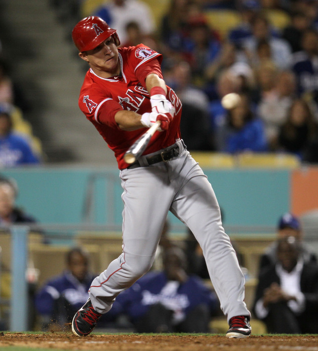 LOS ANGELES, CA - JUNE 11: Mike Trout #27 of the Los Angeles Angels of Anaheim hits an RBI single in the sixth inning against the Los Angeles Dodgers on June 11, 2012 at Dodger Stadium in Los Angeles, California.  (Photo by Stephen Dunn/Getty Images)