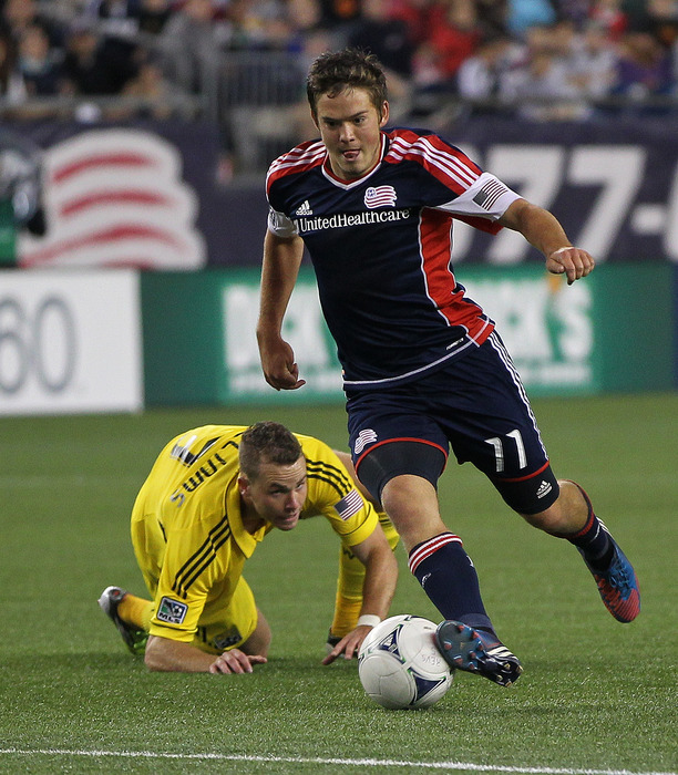 FOXBORO, MA - JUNE 16:  Kelyn Rowe #11 of the New England Revolution gets by Josh Williams #3 of the Columbus Crew in the second half during a game at Gillette Stadium on June 16, 2012 in Foxboro, Massachusetts. (Photo by Jim Rogash/Getty Images)