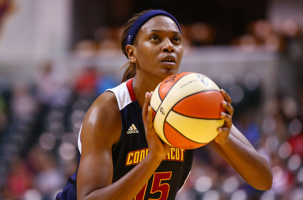 June 21, 2012; Indianapolis, IN, USA; Connecticut Sun forward Asjha Jones (15) shoots a free throw against the Indiana Fever at Bankers Life Fieldhouse. Indiana defeated Connecticut 95-61. Mandatory credit: Michael Hickey-US PRESSWIRE