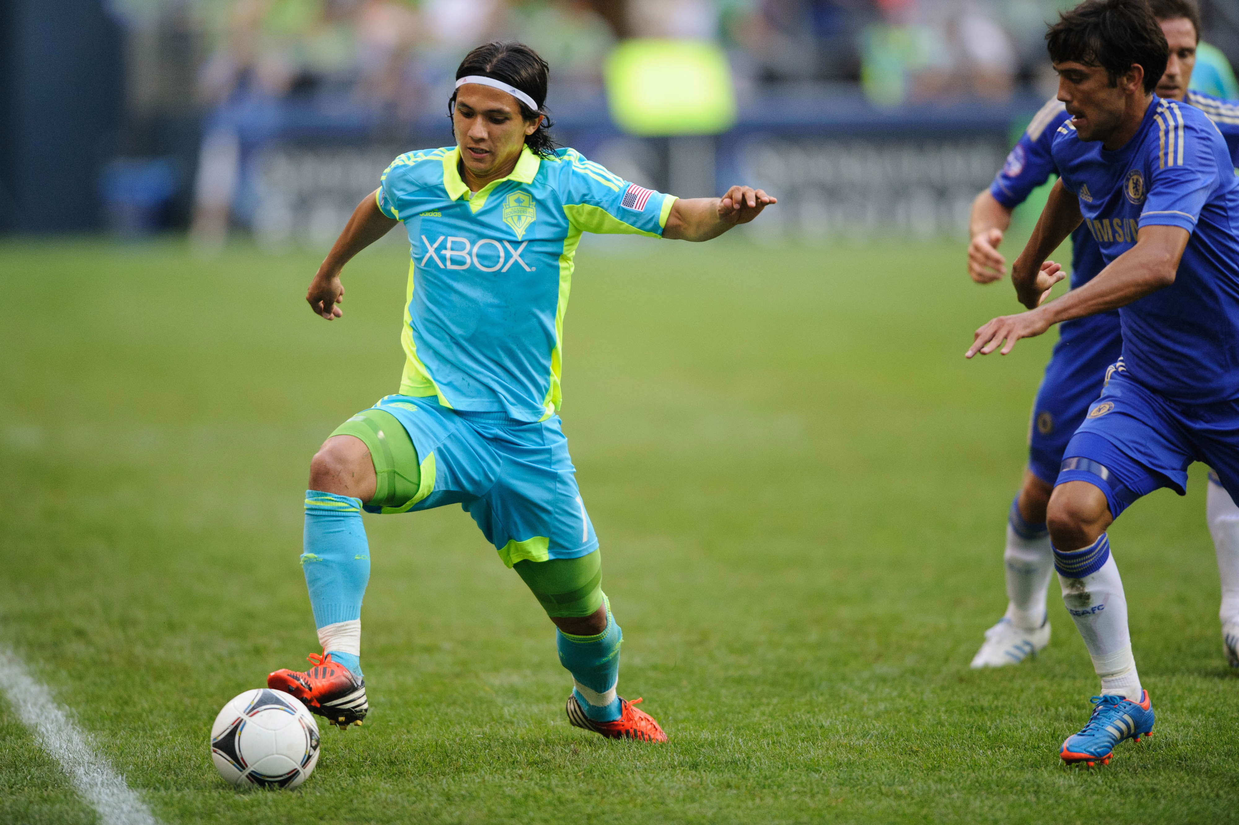 Jul 18, 2012; Seattle, WA, USA; Seattle Sounders FC forward Fredy Montero (17) keeps the ball inbounds during the 2nd half against Chelsea FC at CenturyLink Field. Chelsea FC defeated Seattle 4-2. Mandatory Credit: Steven Bisig-US PRESSWIRE