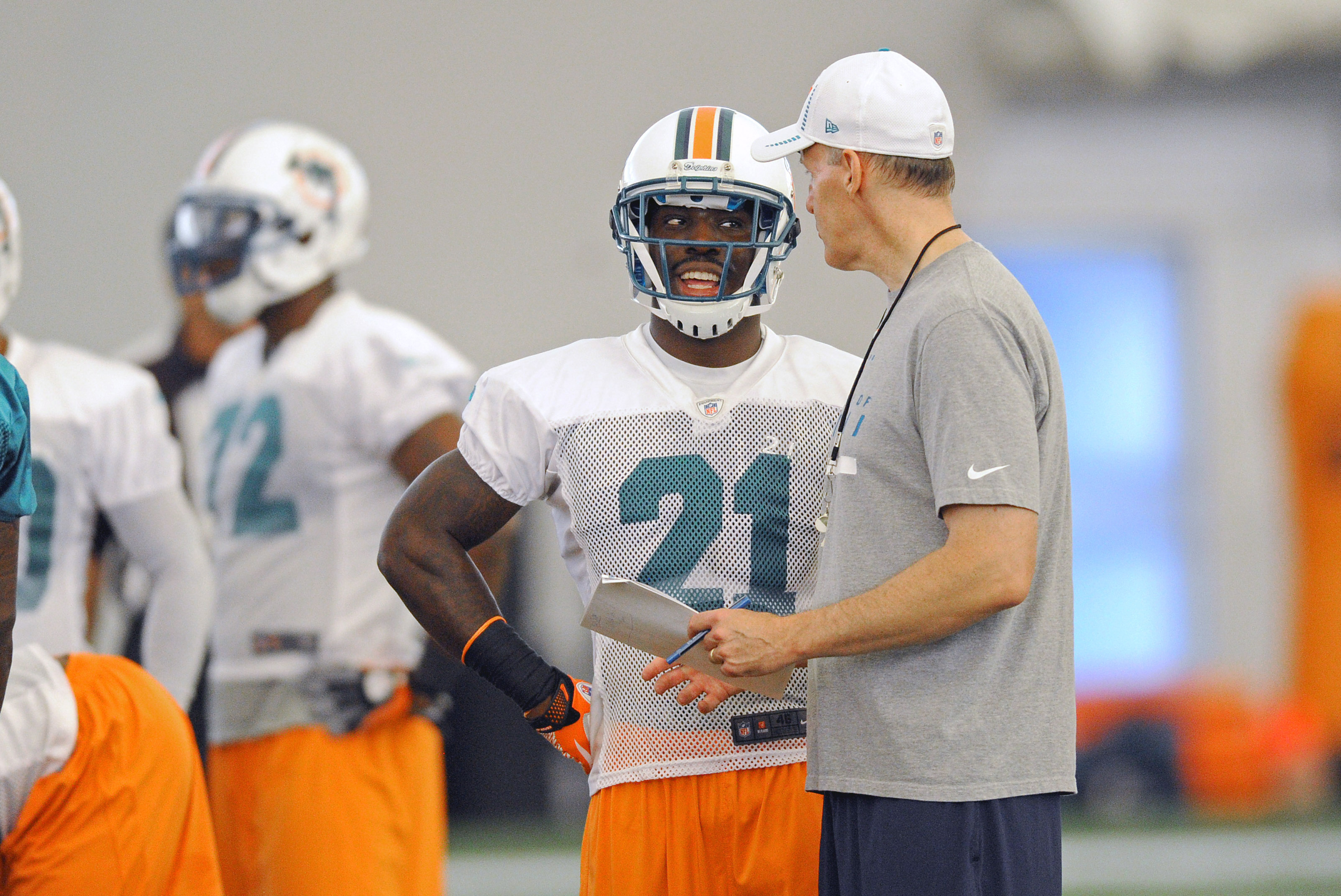 July 27 2012; Davie, FL, USA; Miami Dolphins defensive back Vontae Davis (left) talks with head coach Joe Philbin (right) during practice at the Dolphins training facility. Mandatory Credit: Steve Mitchell-US PRESSWIRE