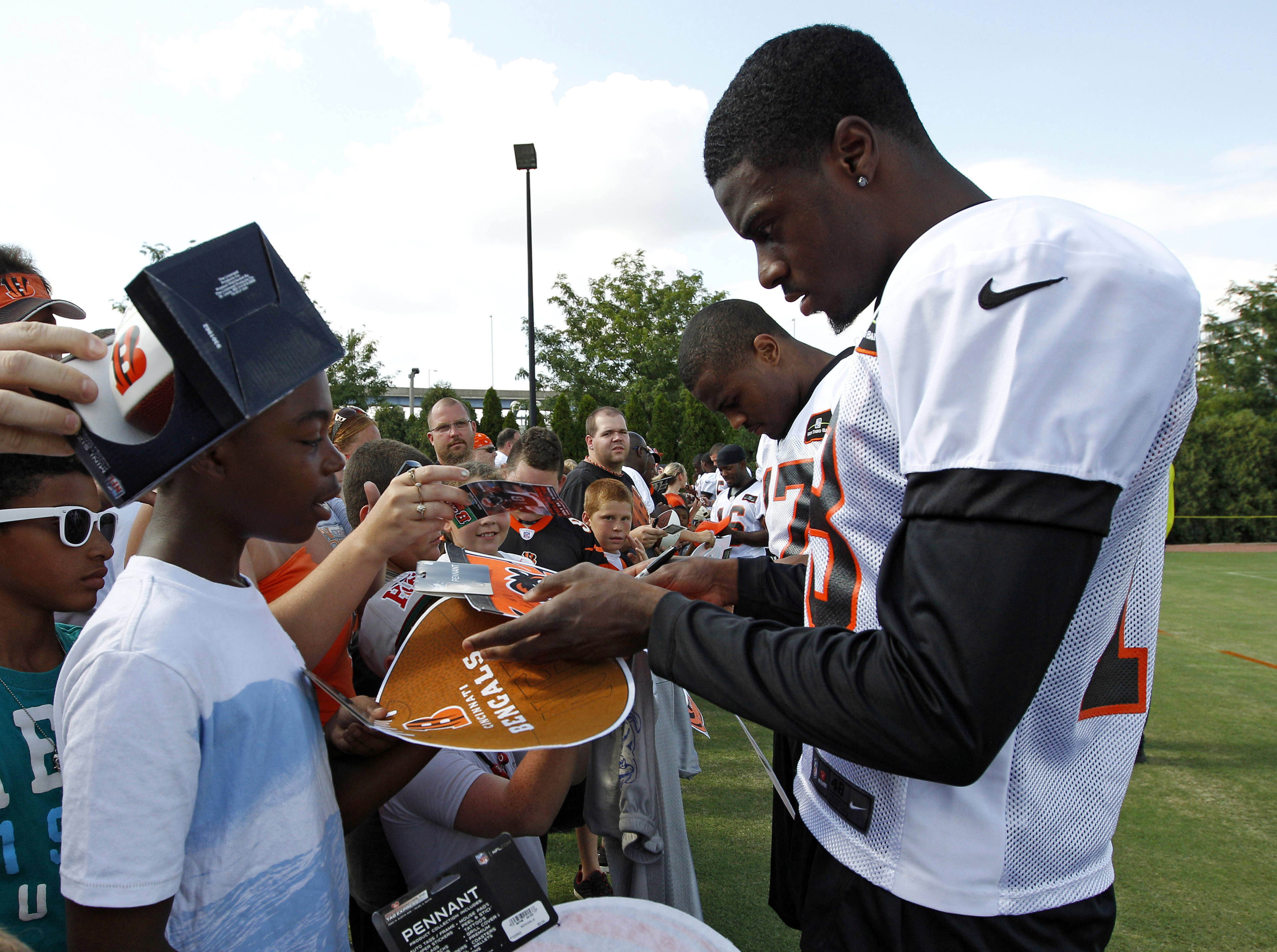 Jul 28, 2012; Cincinnati, OH, USA; Cincinnati Bengals wide receiver A.J. Green (18) signs autographs for fans during training camp at Paul Brown Stadium. Mandatory Credit: Frank Victores-US PRESSWIRE