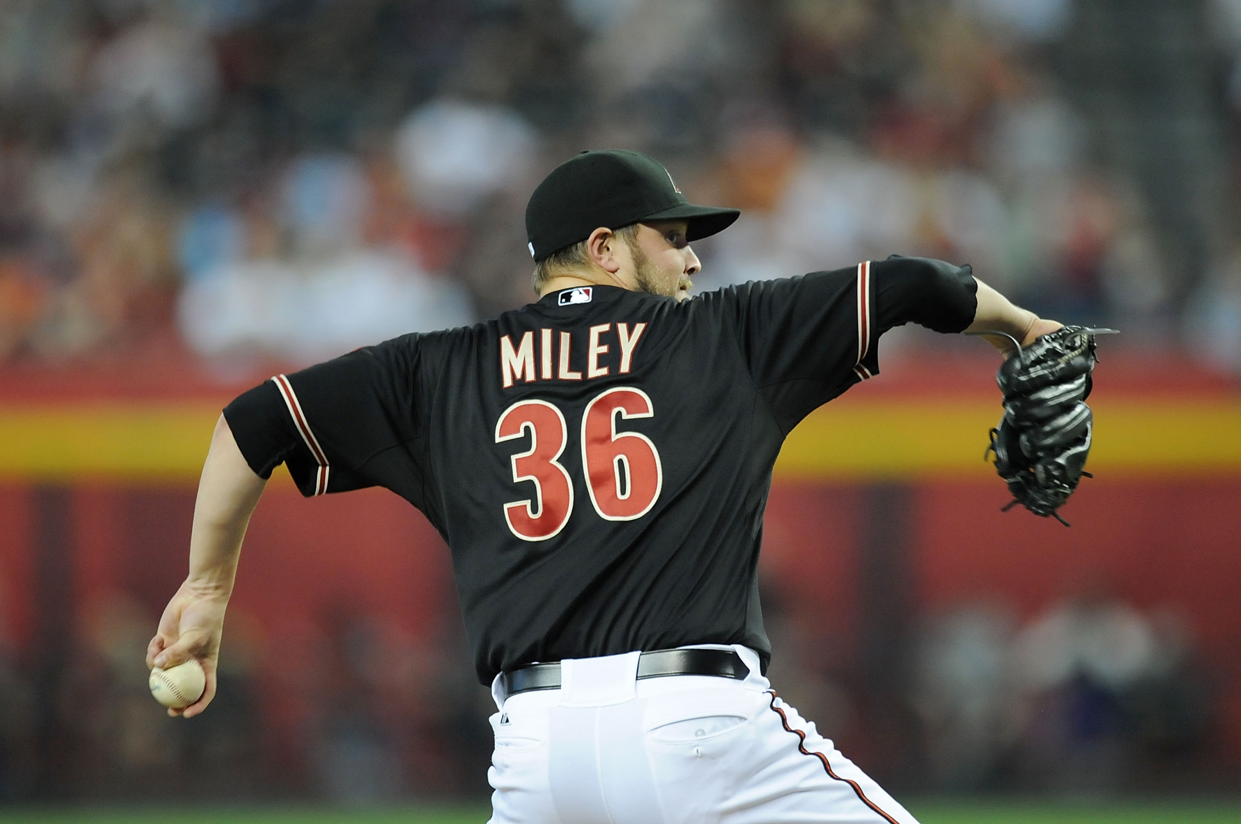 PHOENIX, AZ - AUGUST 11:  Wade Miley #36 of the Arizona Diamondbacks delivers a pitch against the Washington Nationals at Chase Field on August 11, 2012 in Phoenix, Arizona.  (Photo by Norm Hall/Getty Images)
