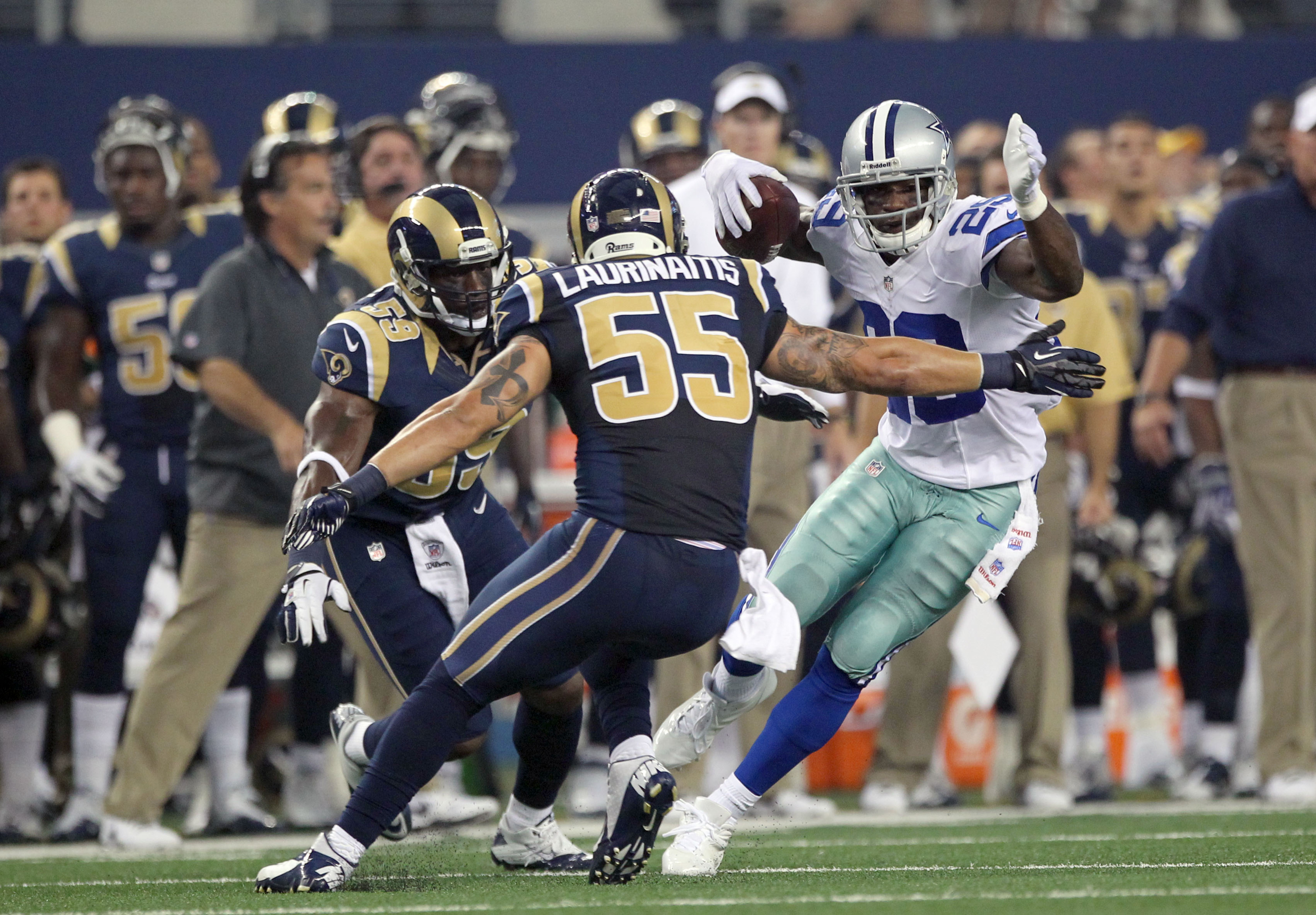 Aug 25, 2012; Arlington, TX, USA; Dallas Cowboys running back DeMarco Murray (29) runs with the ball against St Louis Rams linebacker James Laurinaitis (55) in the first quarter at Cowboys Stadium. Mandatory Credit: Matthew Emmons-US PRESSWIRE