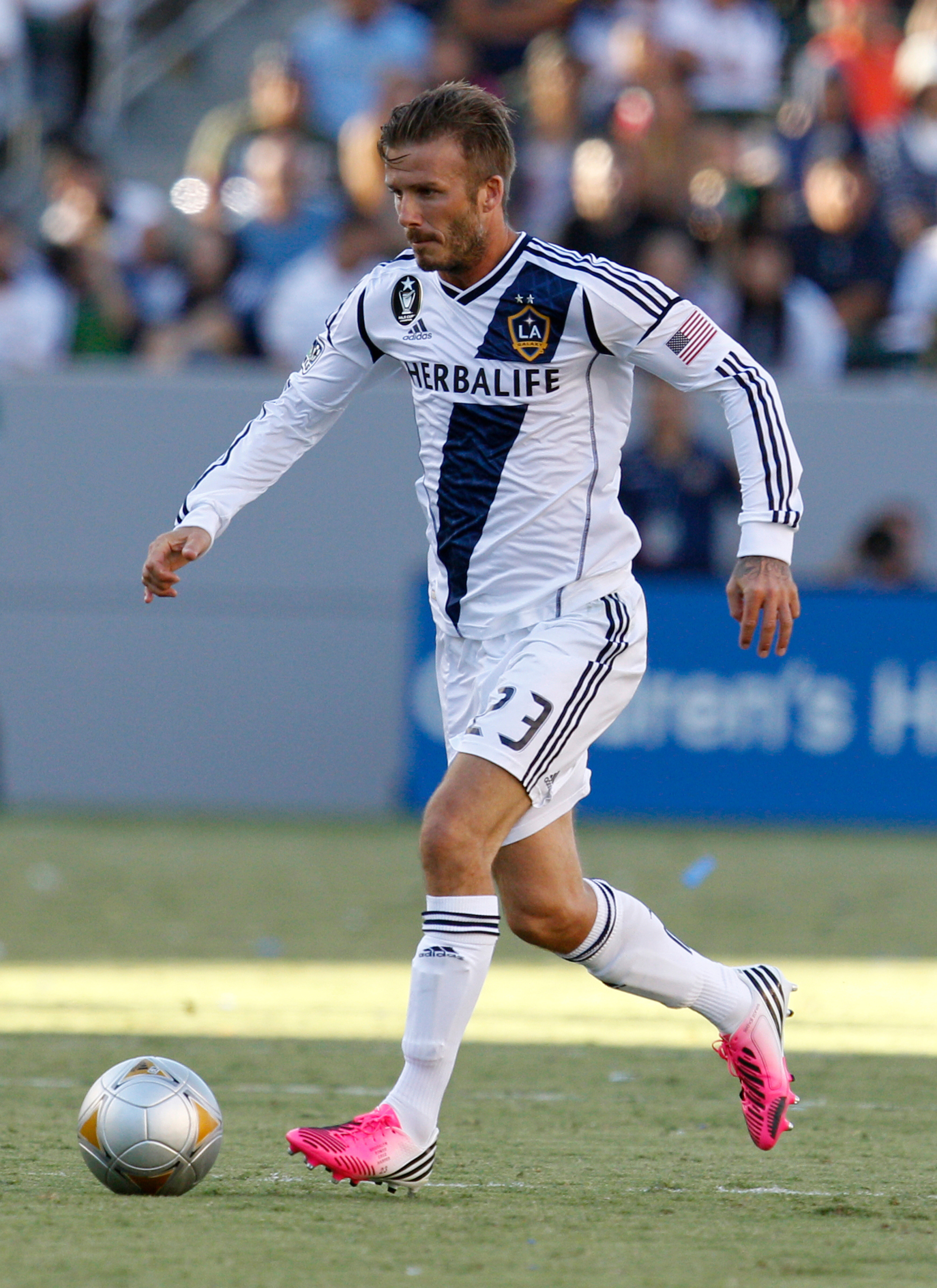 CARSON, CA - AUGUST 26: David Beckham #23 of Los Angeles Galaxy dribbles the ball during the MLS match against FC Dallas at The Home Depot Center on August 26, 2012 in Carson, California. The Galaxy won 2-0. (Photo by Ric Tapia/Getty Images)
