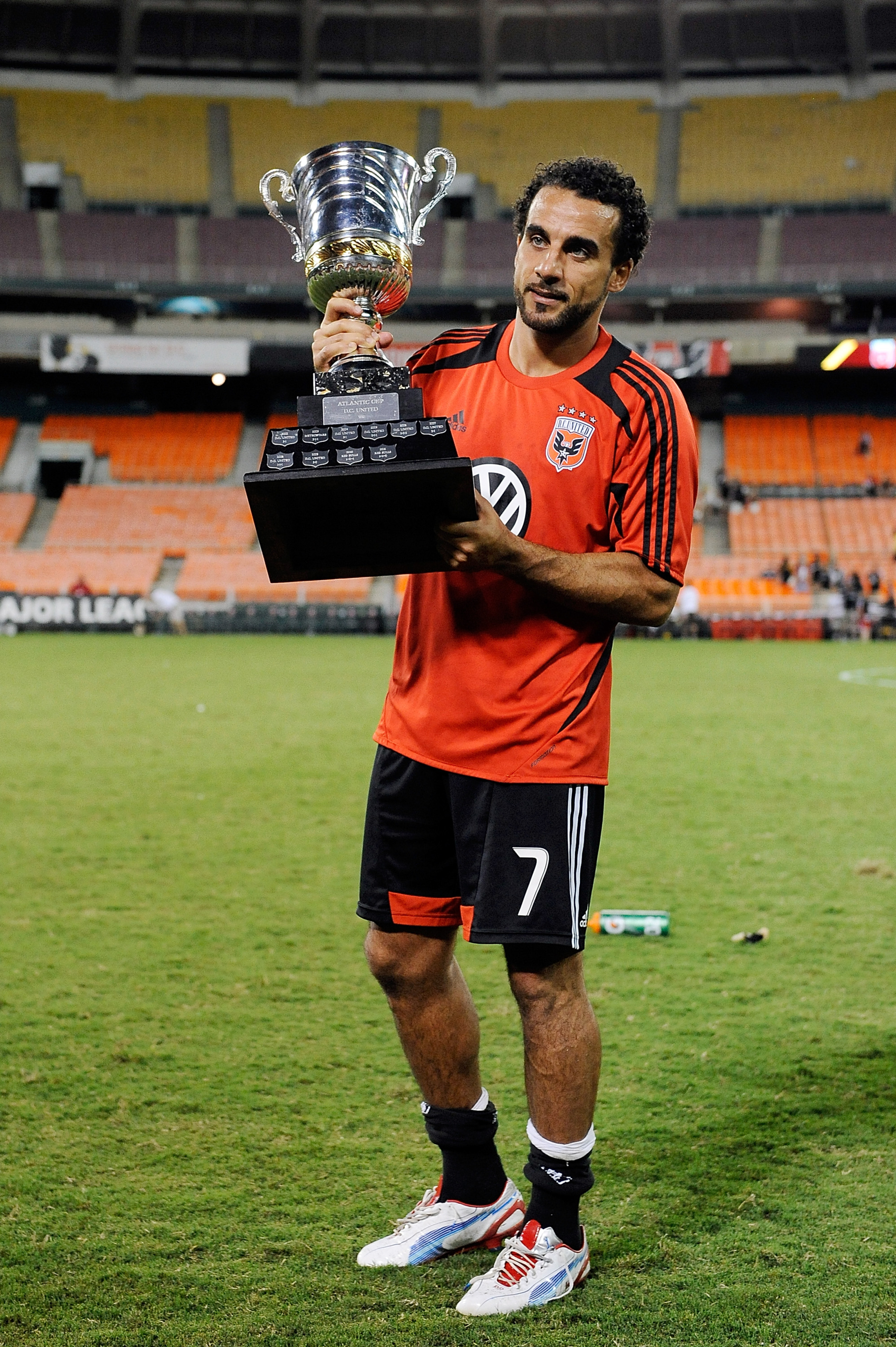 WASHINGTON, DC - AUGUST 29:  Dwayne De Rosario #7 of DC United celebrates with the Atlantic Cup after a game against the New York Red Bulls at RFK Stadium on August 29, 2012 in Washington, DC.  (Photo by Patrick McDermott/Getty Images)