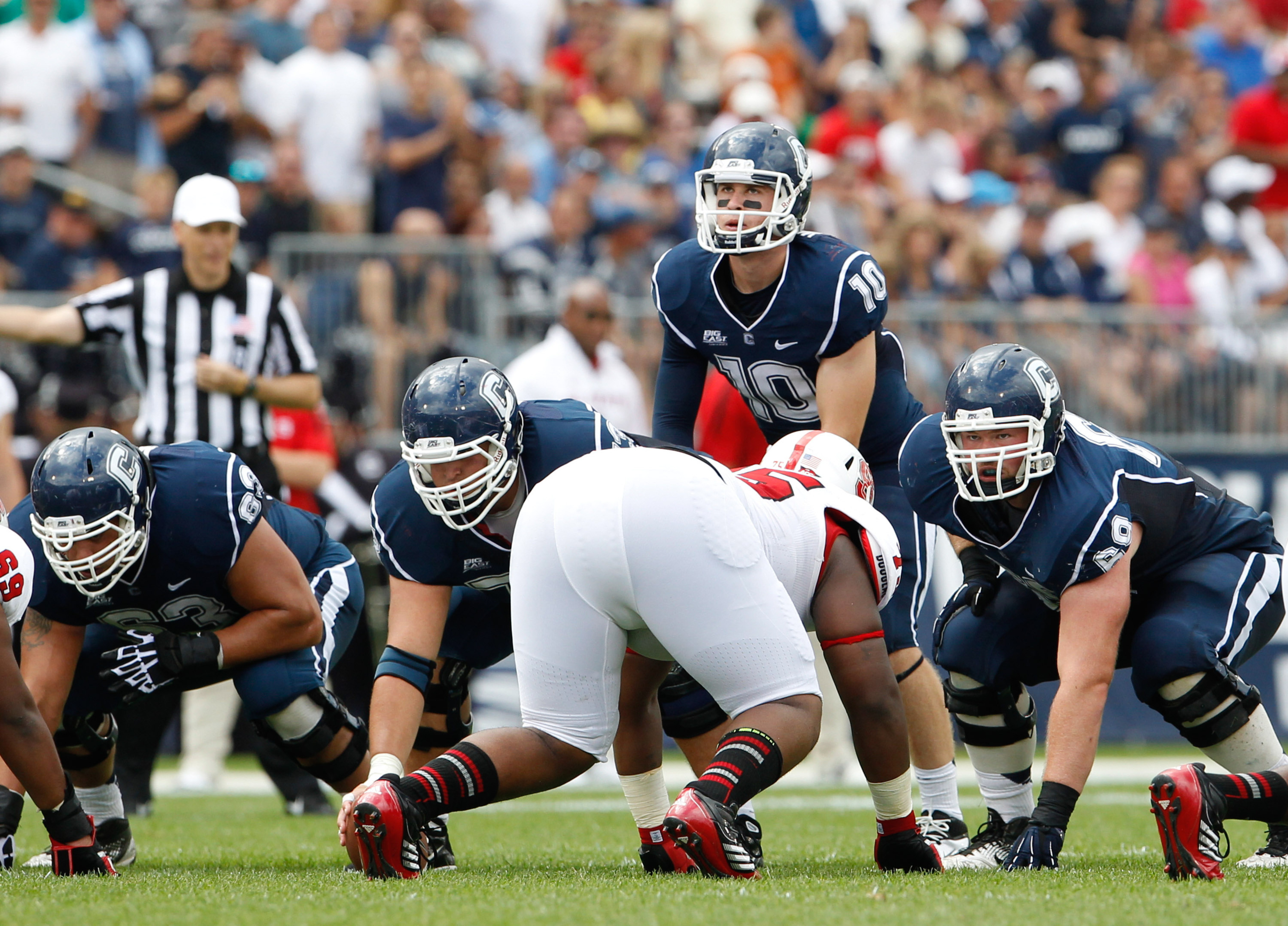 Sep 8, 2012; East Hartford, CT, USA; Connecticut Huskies quarterback Chandler Whitmer (10) at the line of scrimmage against the North Carolina State Wolfpack during the first half at Rentschler Field. Mandatory Credit: David Butler II-US PRESSWIRE