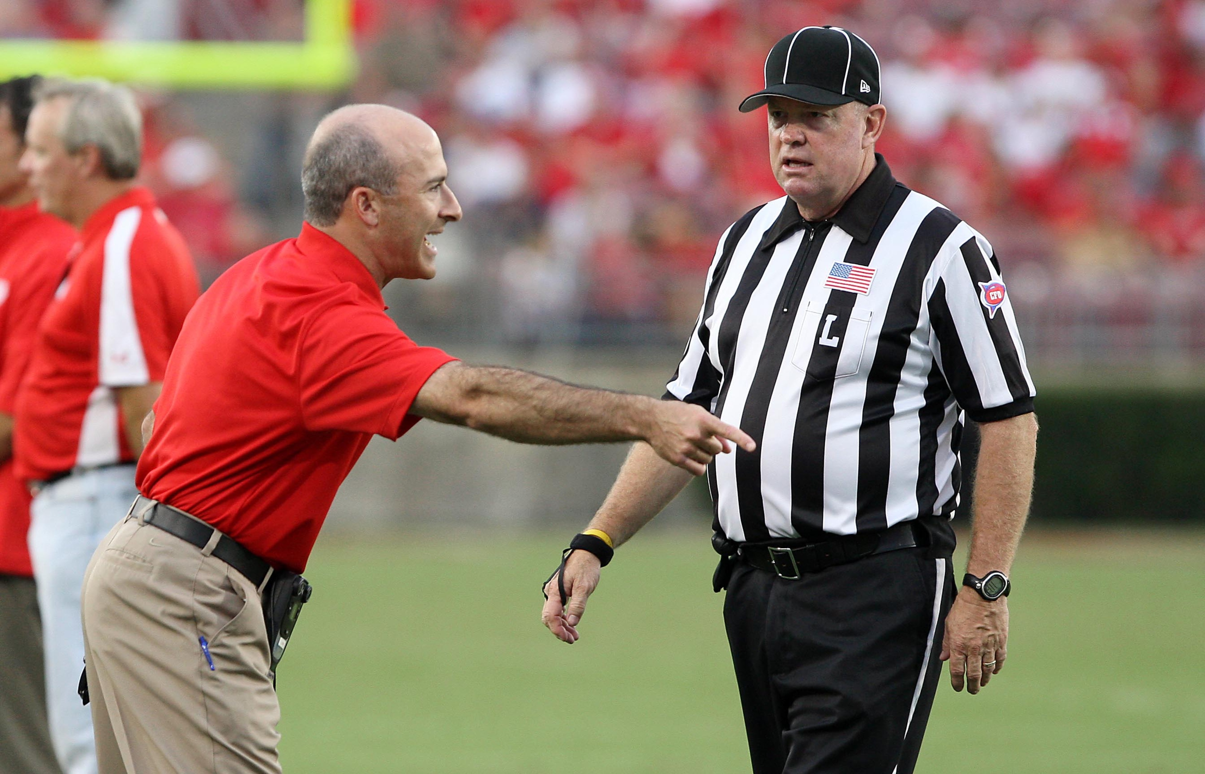 September 08, 2012; Houston, TX, USA; Houston Cougars head coach Tony Levine discusses a call with a referee in the first quarter against the Louisiana Tech Bulldogs at Robertson Stadium. Mandatory Credit: Troy Taormina-US PRESSWIRE