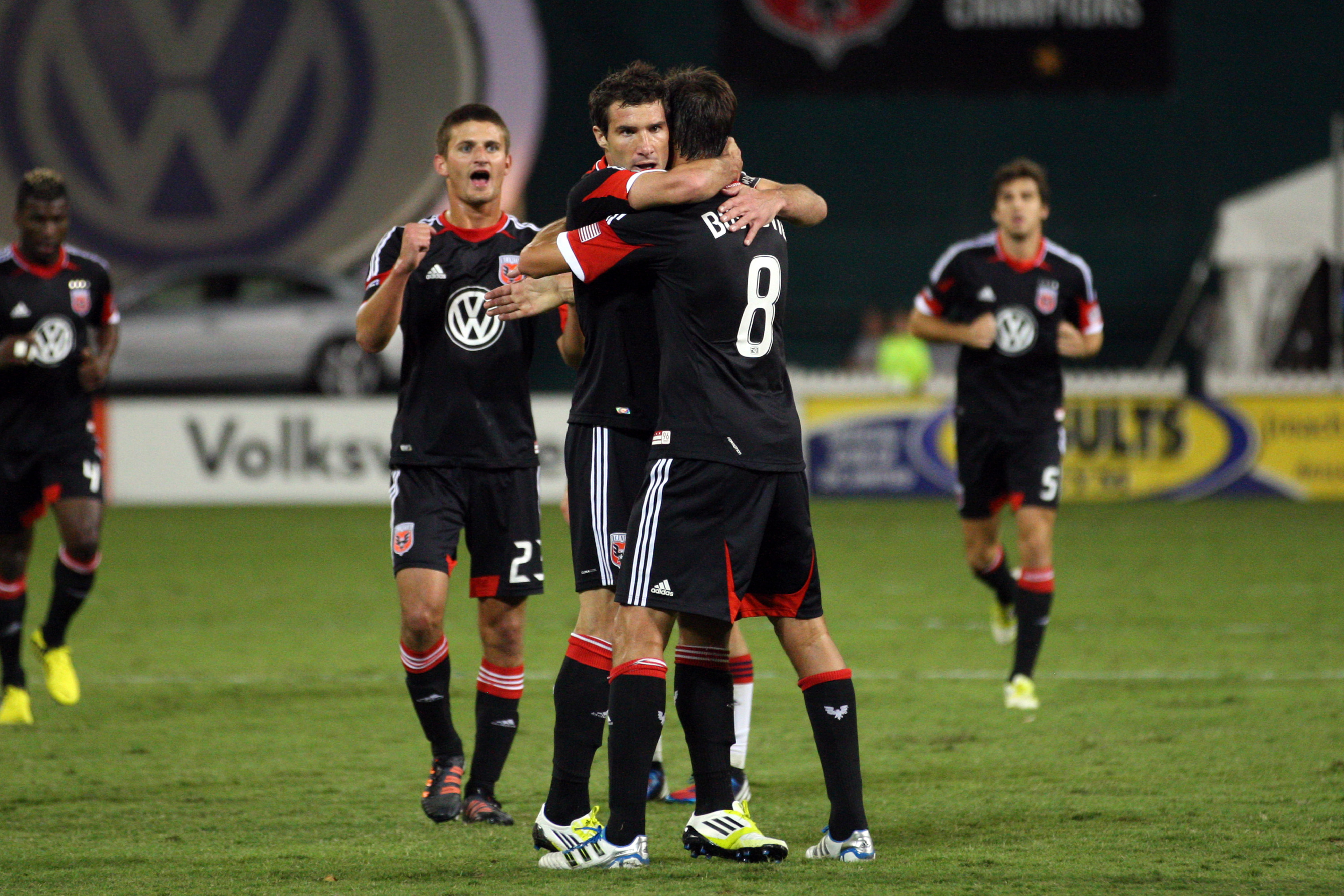 WASHINGTON, DC - SEPTEMBER 15: Chris Pontius #13 of D.C. United celebrates after his goal with Branko Boskovic #8 against # of the New England Revolution at RFK Stadium on September 15, 2012 in Washington, DC.(Photo by Ned Dishman/Getty Images)