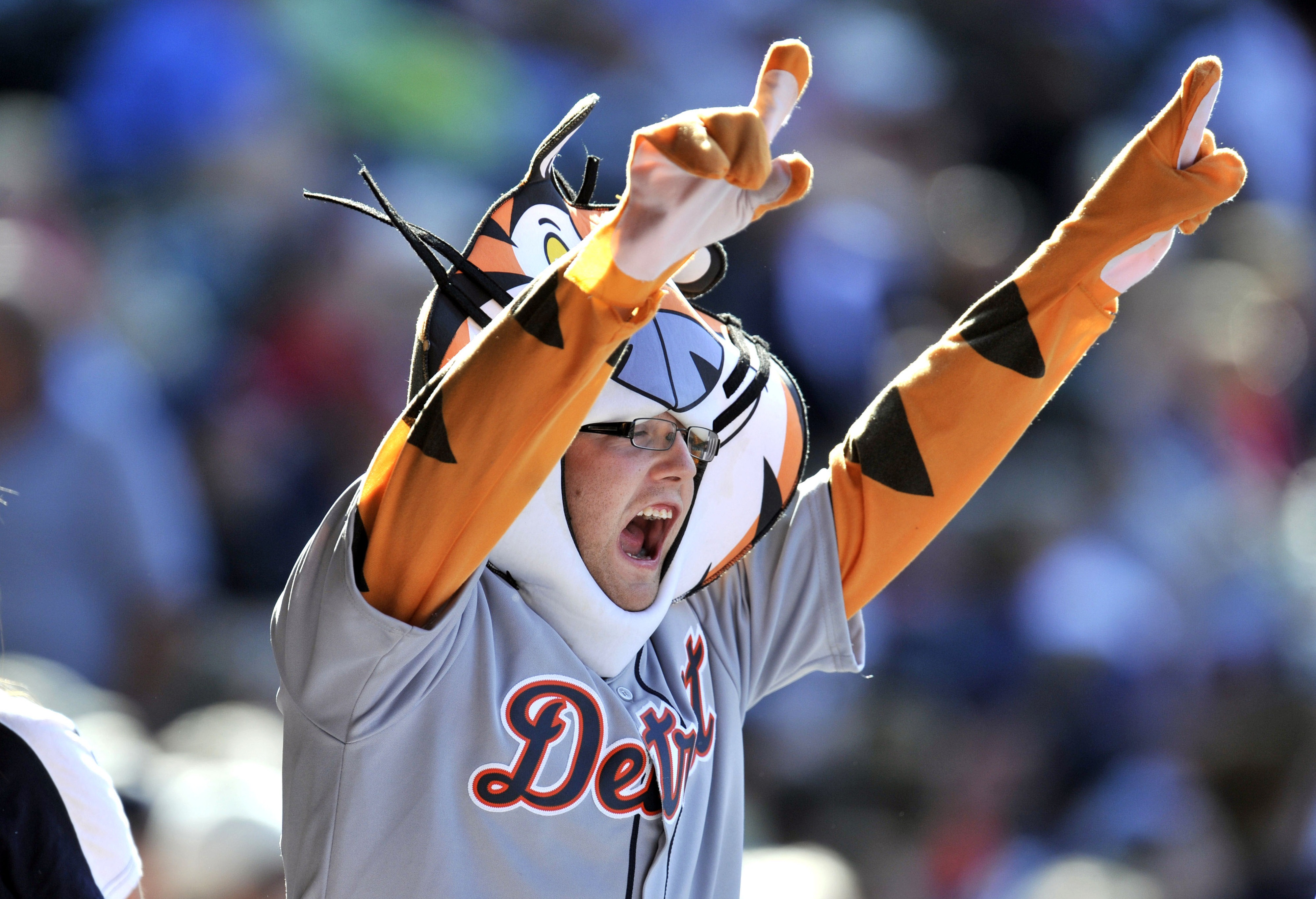 Sep 16, 2012; Cleveland, OH, USA; Detroit Tigers fan cheers during a game against the Cleveland Indians at Progressive Field. Mandatory Credit: David Richard-US PRESSWIRE