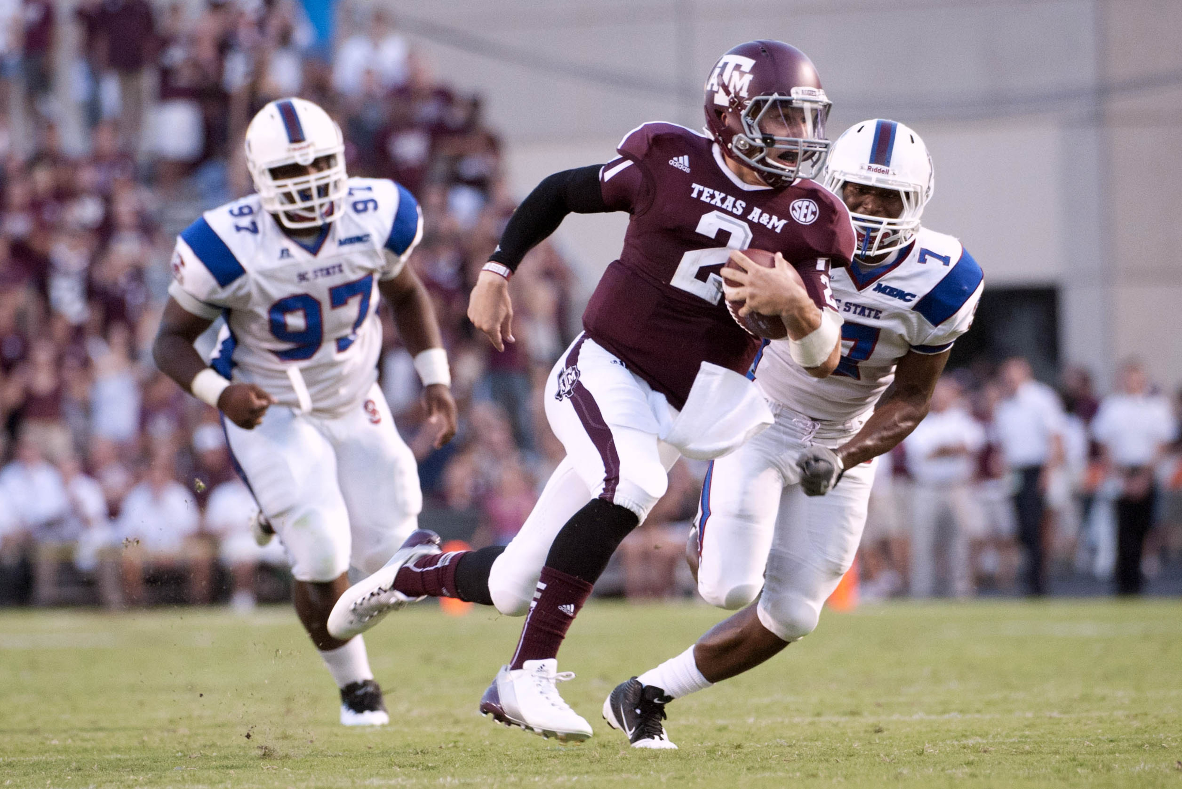 Sep 22, 2012; College Station, TX, USA; Texas A&M Aggies quarterback Johnny Manziel (2) runs for a touchdown against the South Carolina State Bulldogs during the first half at Kyle Field. Mandatory Credit: Brendan Maloney-US PRESSWIRE