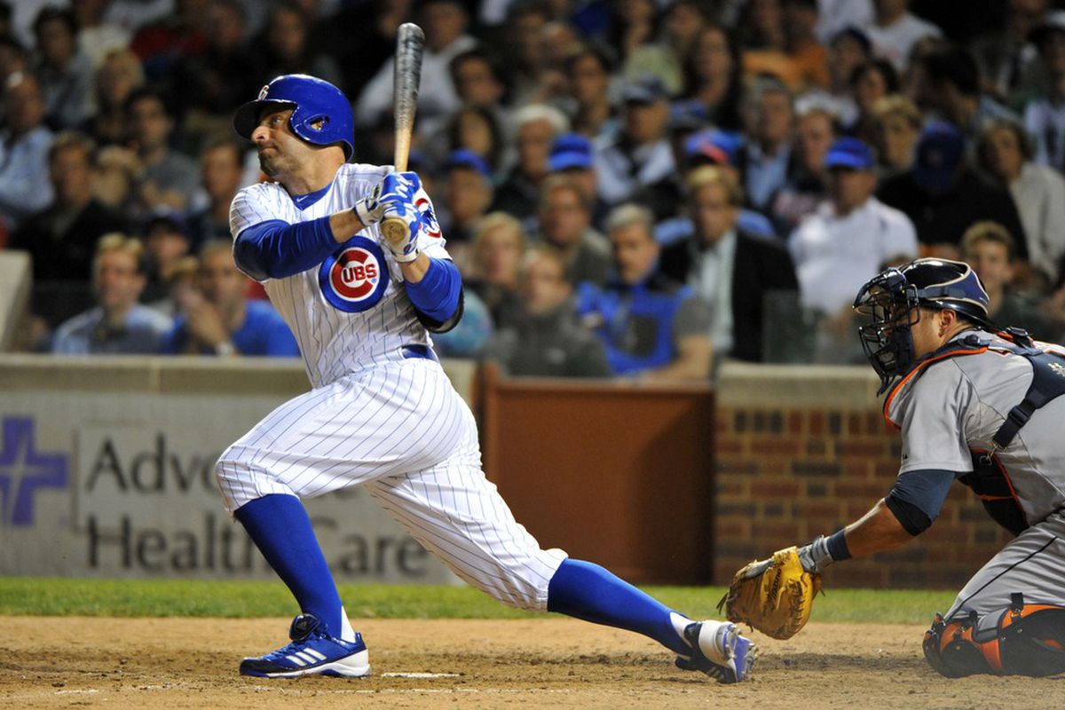 June 12, 2012; Chicago, IL, USA; Chicago Cubs center fielder Reed Johnson (5) hits a single against the Detroit Tigers during the eighth inning at Wrigley Field.  Mandatory Credit: Rob Grabowski-US PRESSWIRE