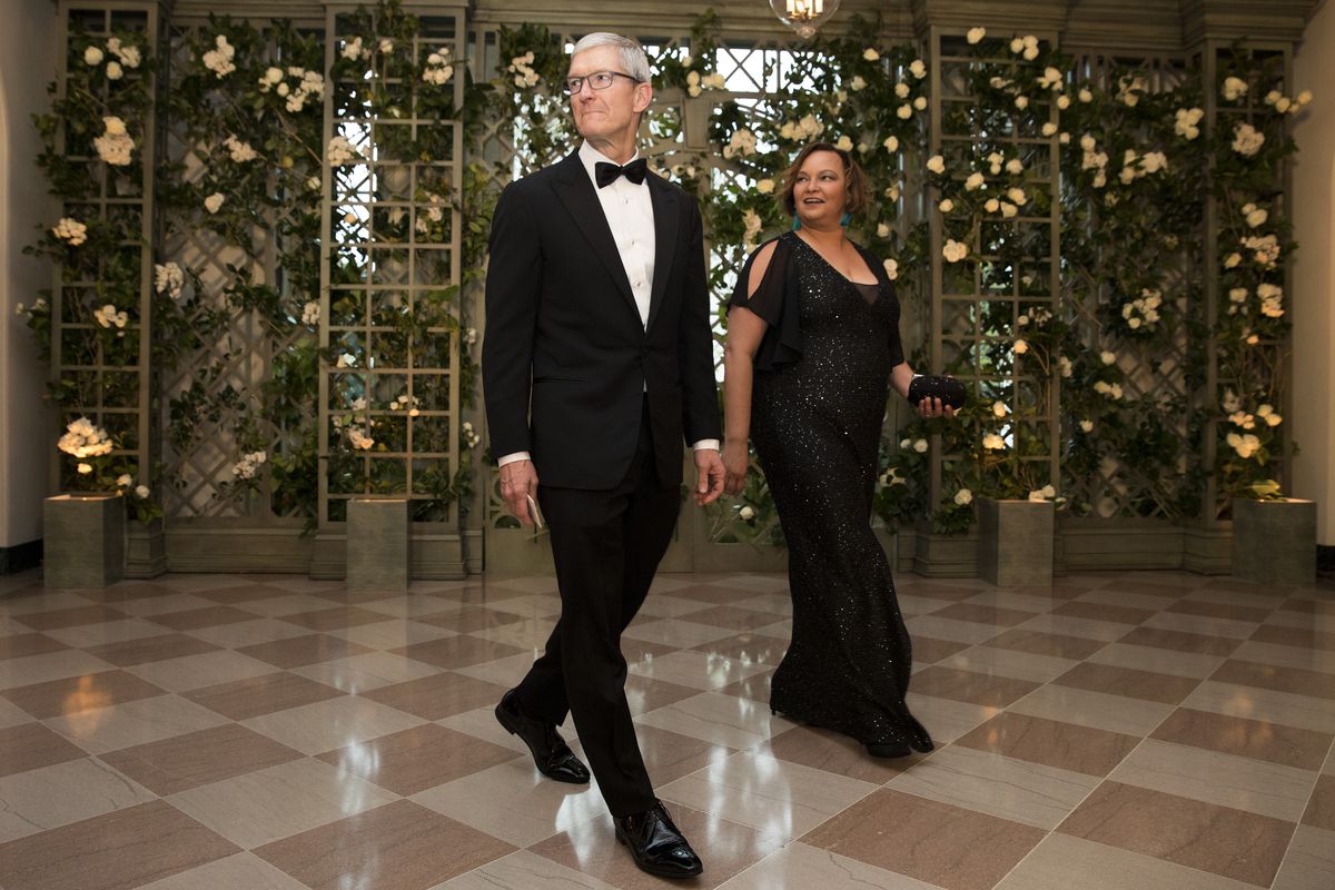 Apple CEO Tim Cook and Lisa Jackson arrive at a gala