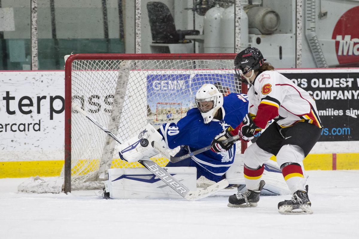 Furies goalie Sonja van der Bliek (30) stretches out to make a save on Inferno rookie Megan Grenon (6) 