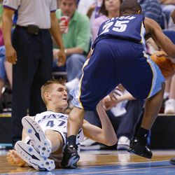 Utah Jazz's Andrei Kirilenko defends Memphis Grizzlies Earl Watson in NBA action in Salt Lake City March 11, 2005. 