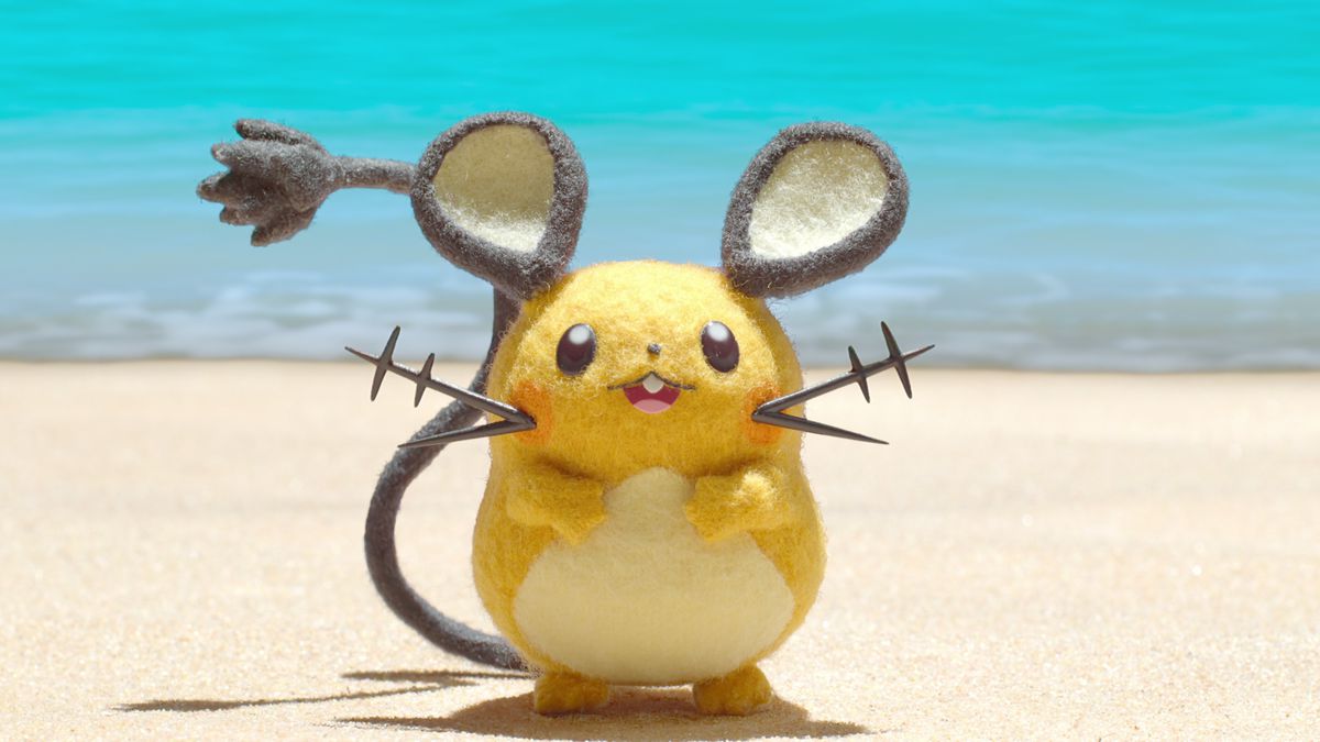 A Dedenne — an orange mouse with big round ears — on the beach!