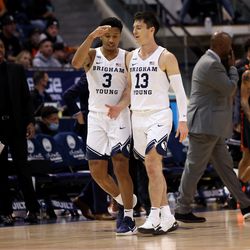 Brigham Young Cougars guard Te’Jon Lucas (3) high-fives teammate Brigham Young Cougars guard Alex Barcello (13) as BYU and Pacific play in an NCAA basketball game in Provo at the Marriott Center on Thursday, Jan. 6, 2022. BYU won 73-51.