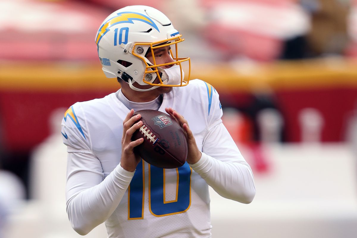 Justin Herbert #10 of the Los Angeles Chargers warms up prior to the game against the Kansas City Chiefs at Arrowhead Stadium on January 03, 2021 in Kansas City, Missouri.