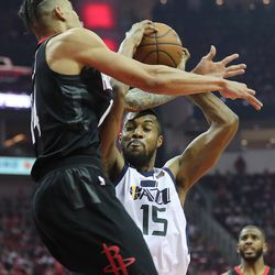 Utah Jazz forward Derrick Favors (15) battles Houston Rockets guard Gerald Green (14) for the ball as the Utah Jazz and the Houston Rockets play game two of the NBA playoffs at the Toyota Center in Houston on Wednesday, May 2, 2018.