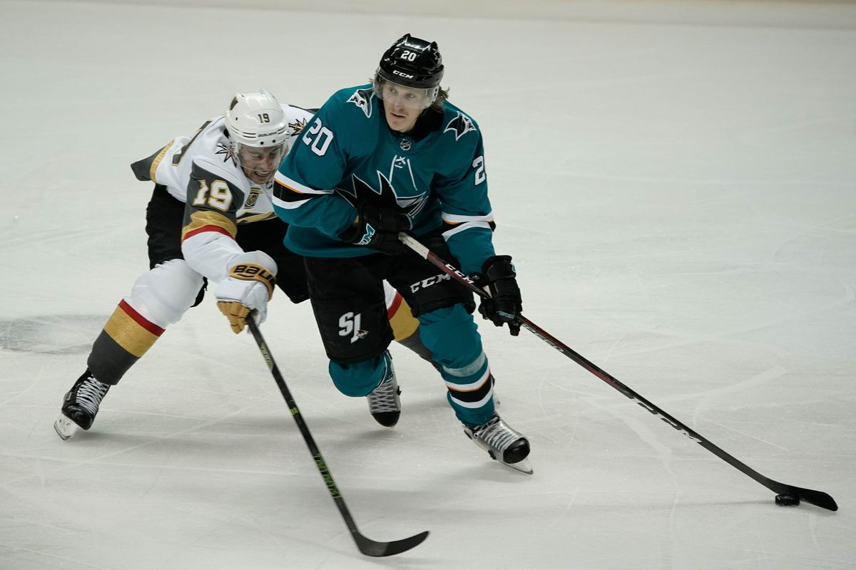 May 6, 2018; San Jose, CA, USA; San Jose Sharks left wing Marcus Sorensen (20) and Vegas Golden Knights right wing Reilly Smith (19) fight for control of the puck during the third period in game six of the second round of the 2018 Stanley Cup Playoffs at