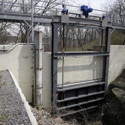The Bowman Avenue Dam is seen in Rye Brook, N.Y., Thursday, March 24, 2016.  Seven hackers tied to the Iranian government were charged Thursday in a series of punishing cyberattacks on dozens of banks and a small dam outside New York City, intrusions that reached into America's infrastructure and disrupted the financial system, U.S. law enforcement officials said. 