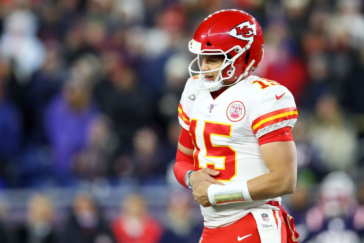 Patrick Mahomes of the Kansas City Chiefs grabs his hand during the first half of the game against the Kansas City Chiefs at Gillette Stadium on December 08, 2019 in Foxborough, Massachusetts.