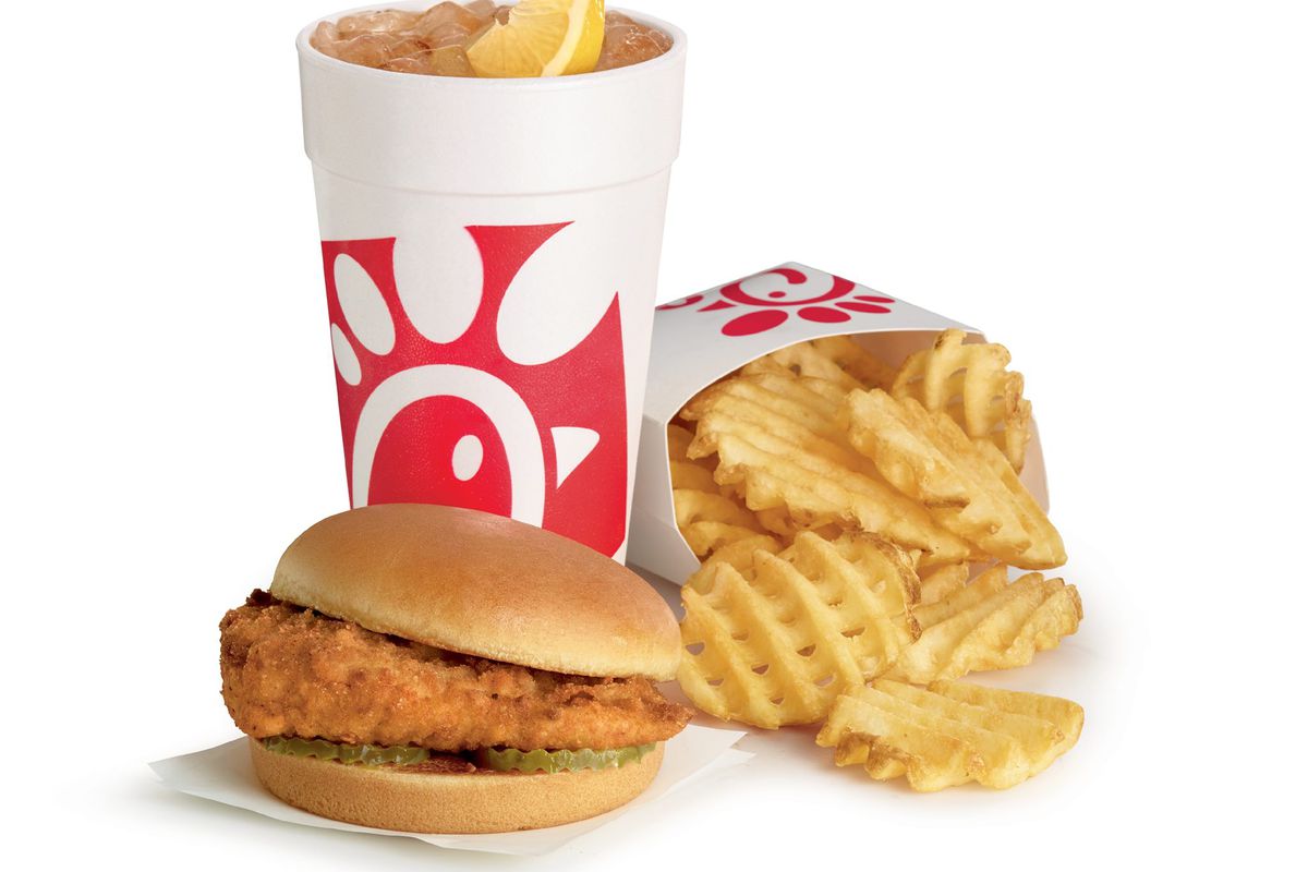 A chicken sandwich, drink, and waffle fries