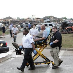 A tornado victim is wheels to an ambulance  at 147th and Hudson , Monday,  May 20, 2013. 