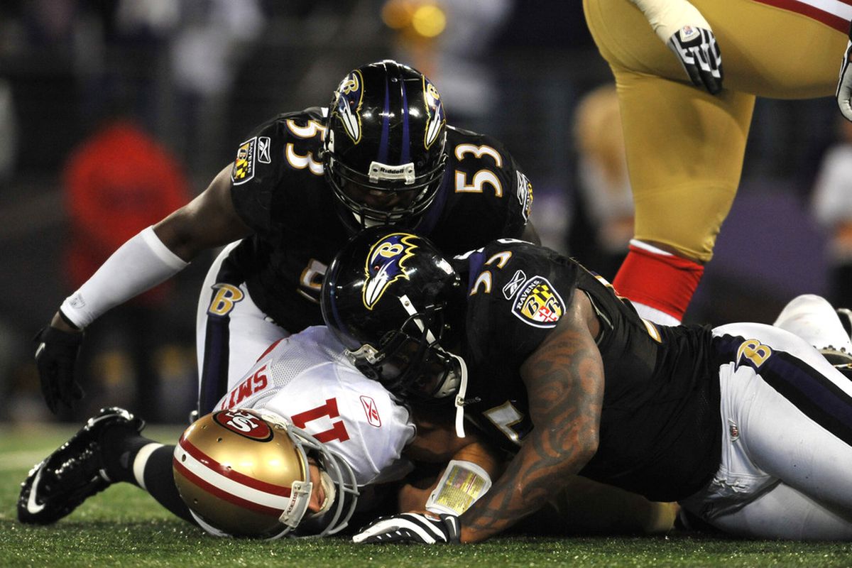 BALTIMORE - NOVEMBER 24:  Jameel McClain #53 and Terrell Suggs #55 of the Baltimore Ravens sack Alex Smith #11 of the San Francisco 49ers at M&T Bank Stadium on November 24, 2011 in Baltimore, Maryland.  (Photo by Larry French/Getty Images)